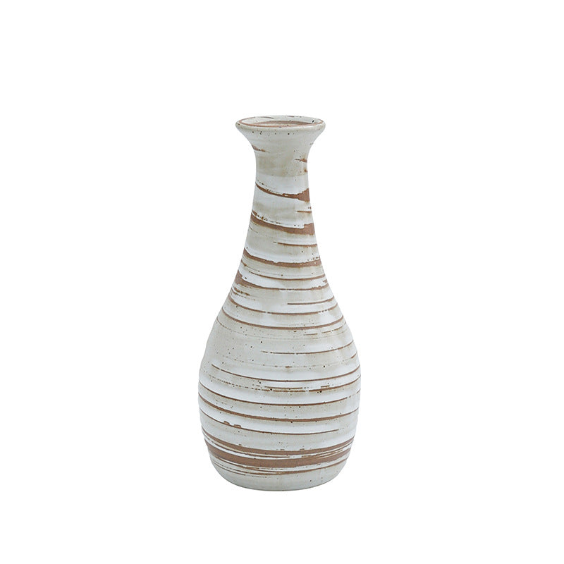 White ceramic vase with brown stripes on a white background