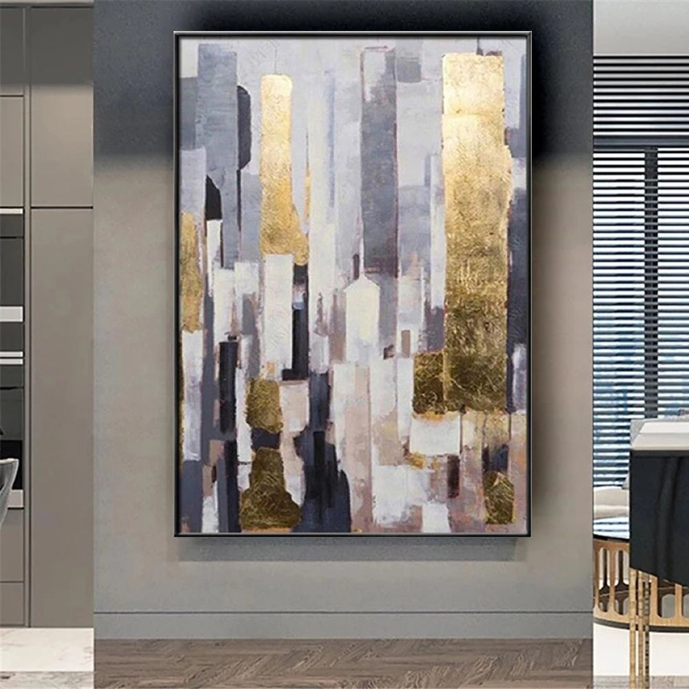 Abstract art painting with gold and gray tones in a modern interior setting.