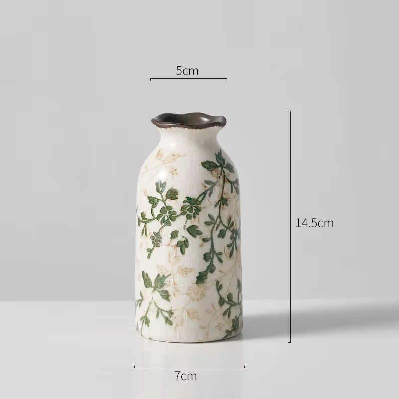 Ceramic vase with floral design and measurements on a gray background