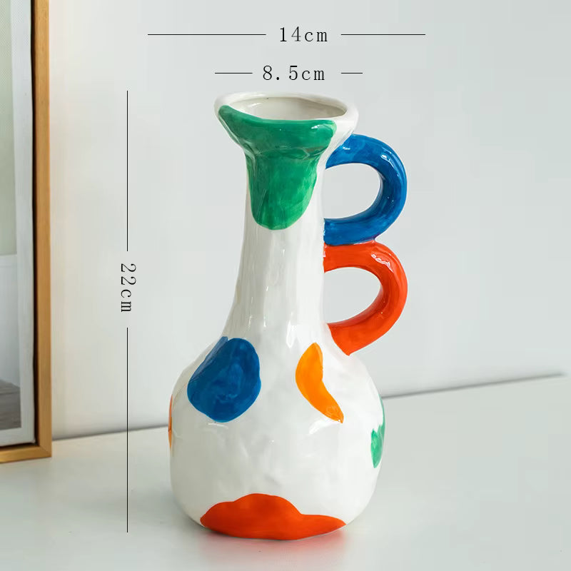 Colorful ceramic vase with measurements on a white background