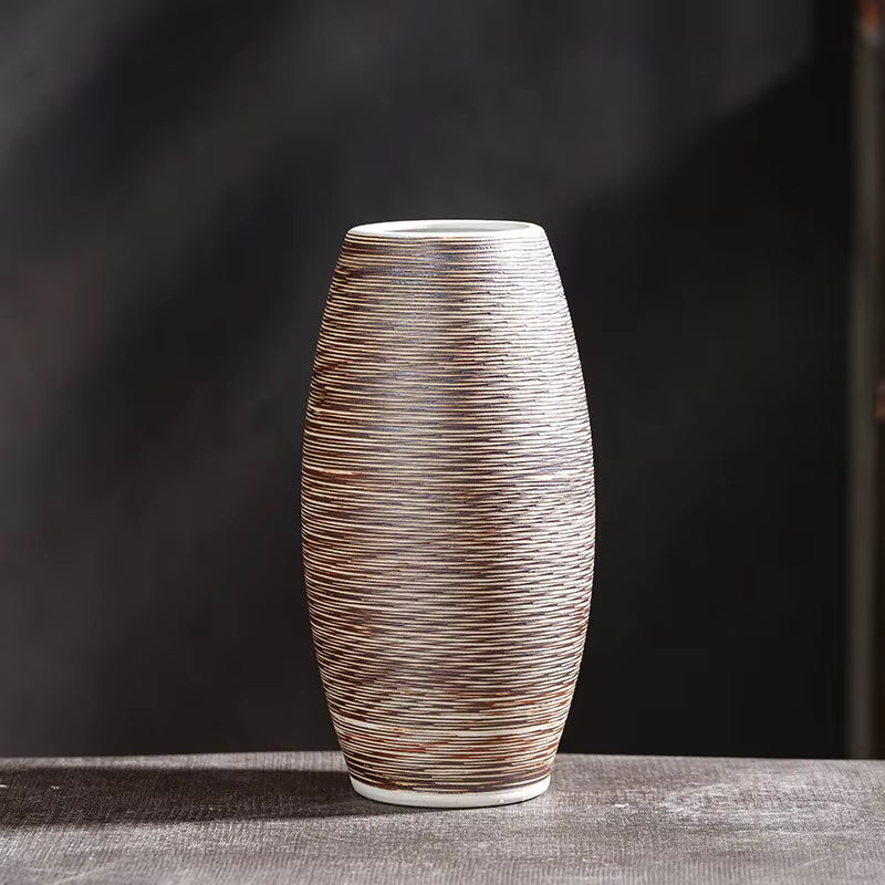Textured ceramic vase on a dark background