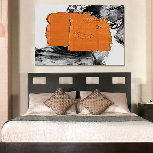 Abstract art piece with orange and black brushstrokes above a bed in a bedroom.