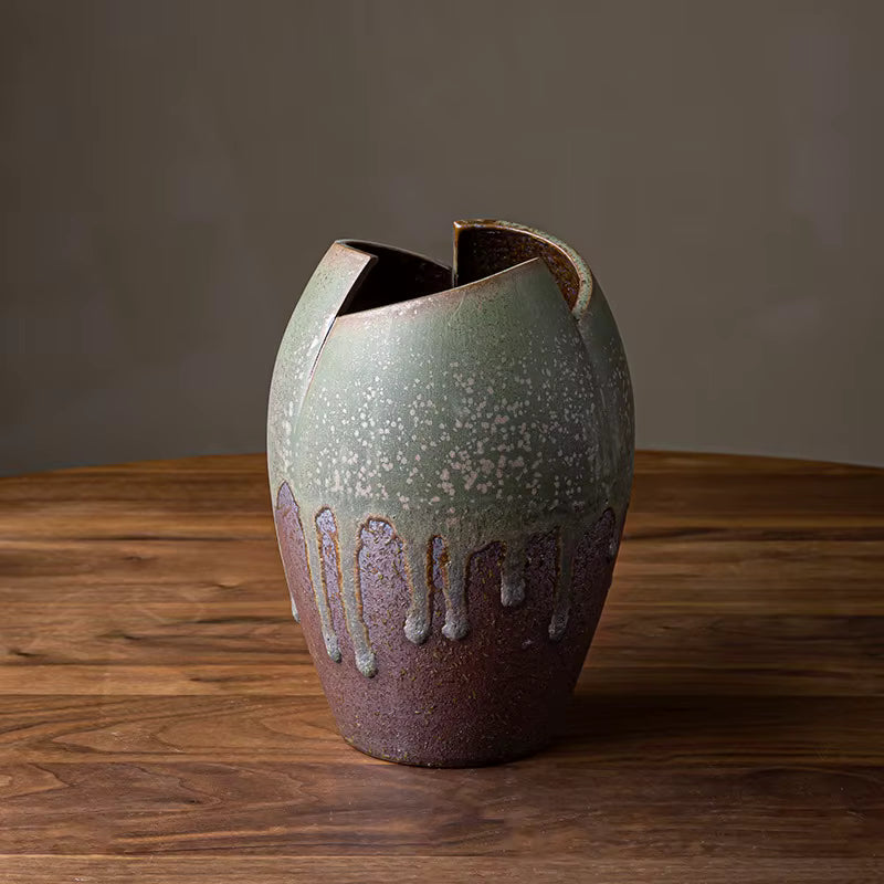 Ceramic vase with unique design on a wooden surface