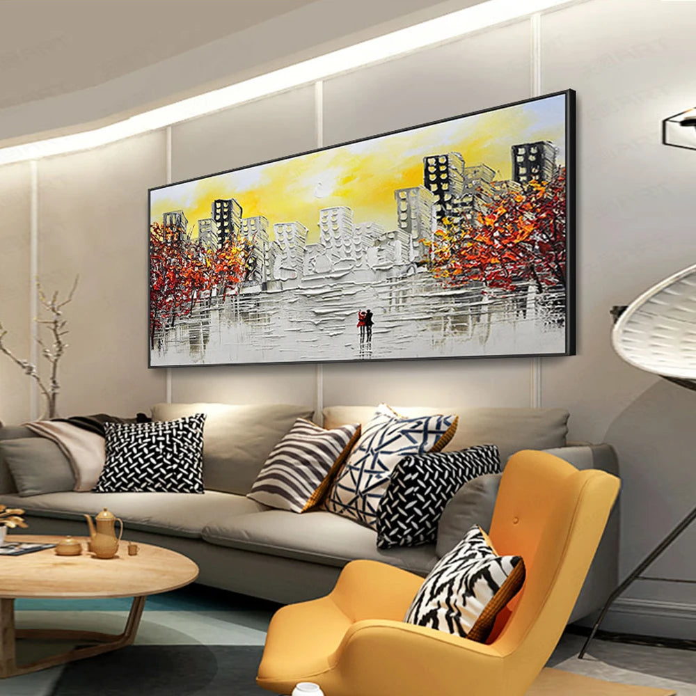 Modern living room with a large abstract painting on the wall, gray sofa with patterned cushions, and yellow armchair.
