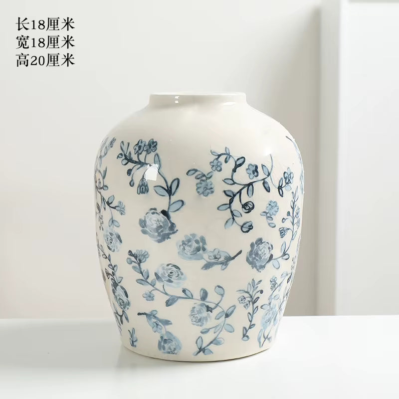 White vase with blue floral patterns on a white background
