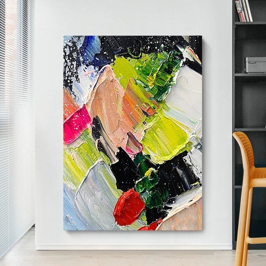 Abstract painting with vibrant colors on a white wall in a room with a chair and window blinds.