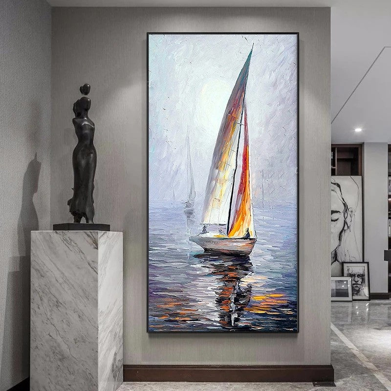 Sailboat painting on a wall in an interior setting with a statue and another artwork.