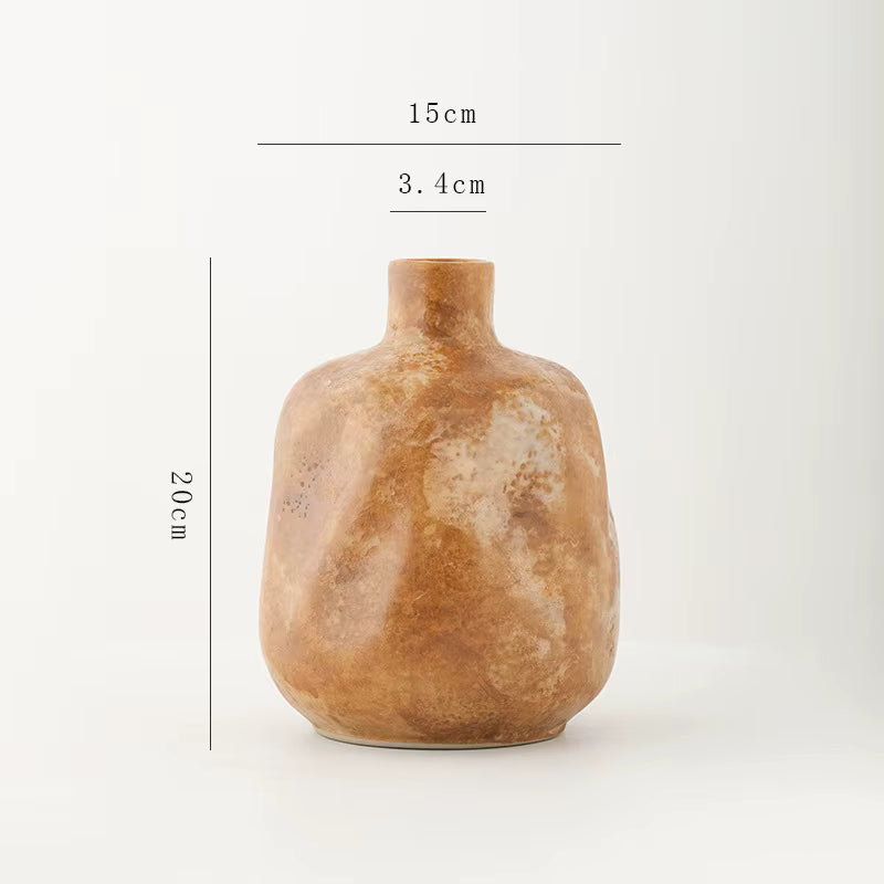 Brown ceramic vase with measurements on a white background