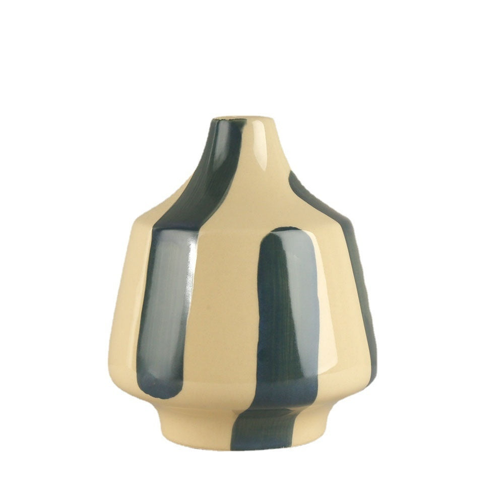 Beige and green ceramic vase on a white background