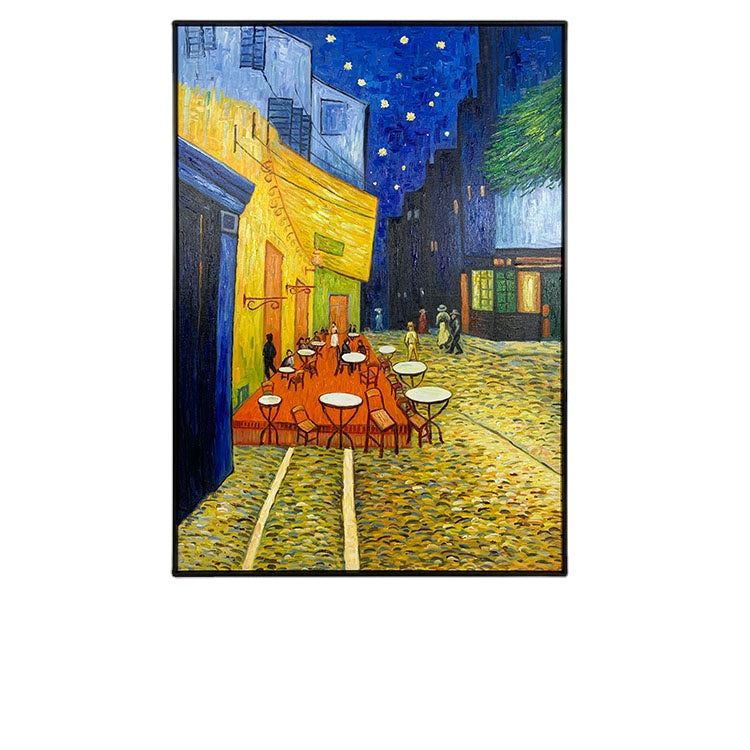 Framed artwork of a street scene with tables and chairs, reminiscent of Van Gogh's style.