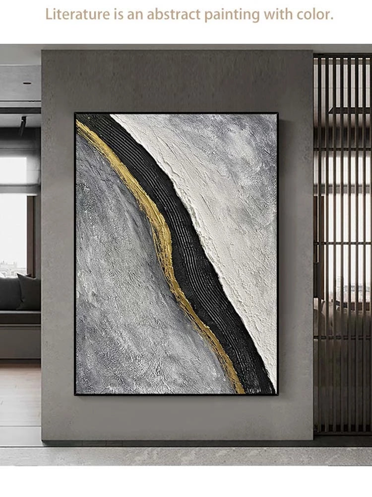 Abstract painting with gold and black strokes on a gray background, displayed in a modern interior setting.