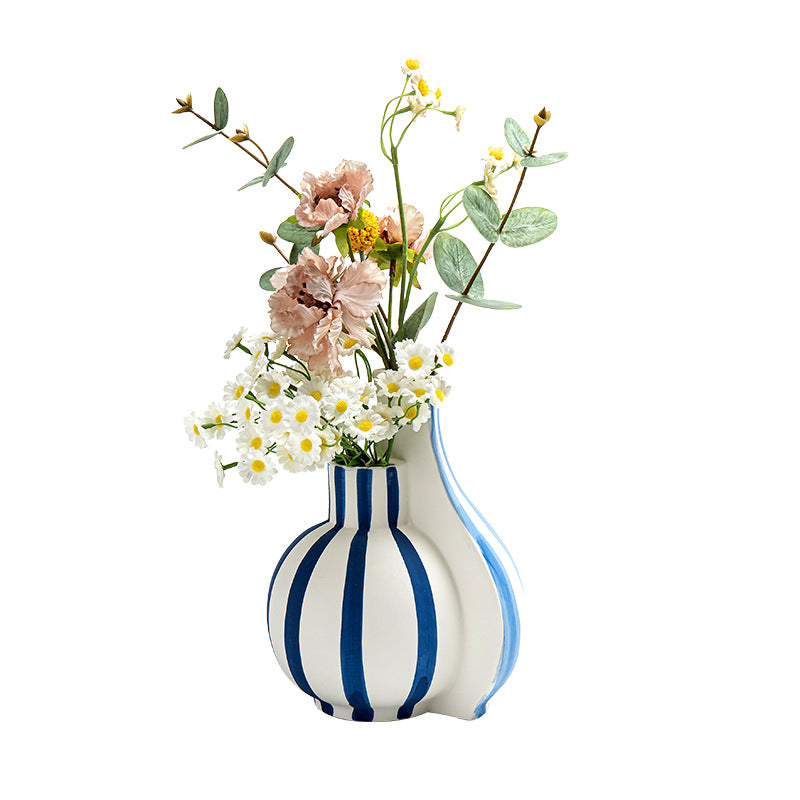 Striped vase with flowers on a white background