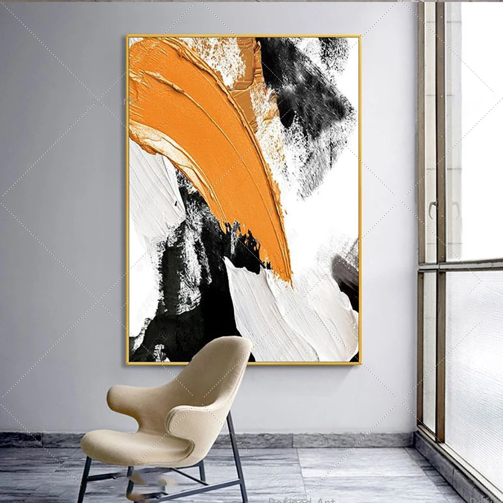 Abstract art piece with orange, black, and white colors on a wall above a chair.