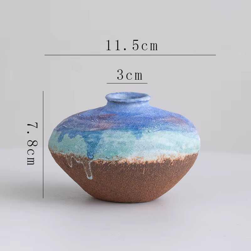 Ceramic vase with multicolored glaze and measurements on a gray background