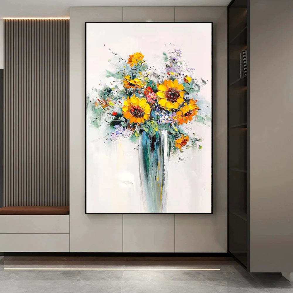 Framed abstract painting of flowers on a wall in a modern interior setting.