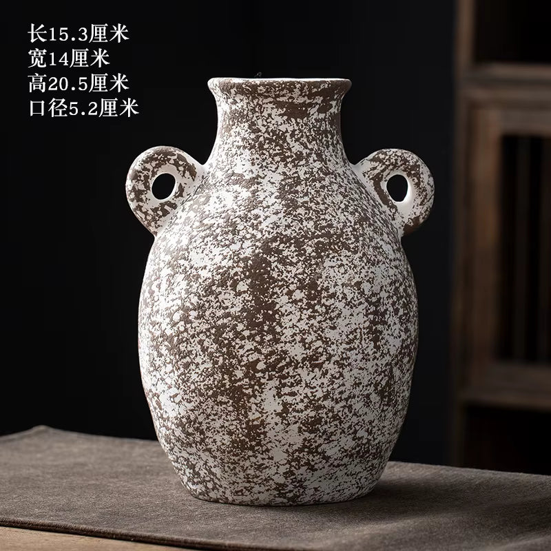 Decorative ceramic vase with textured surface on a dark background