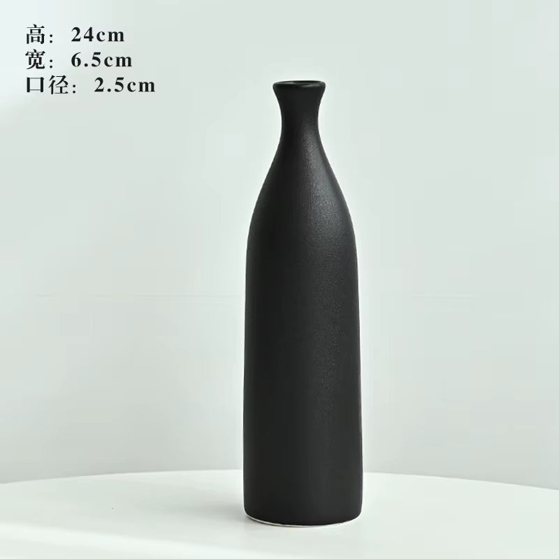 Black vase on a white background with dimensions displayed