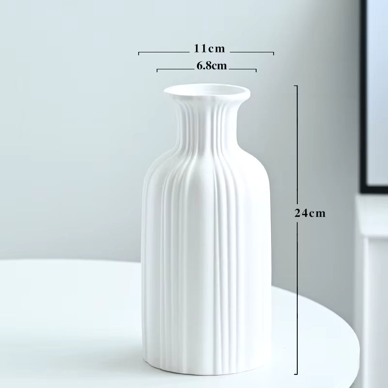 White vase with measurements on a light gray background