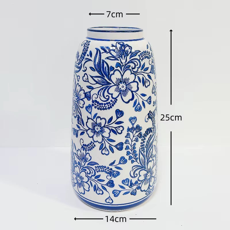 Ceramic vase with blue floral patterns and measurements on a white background