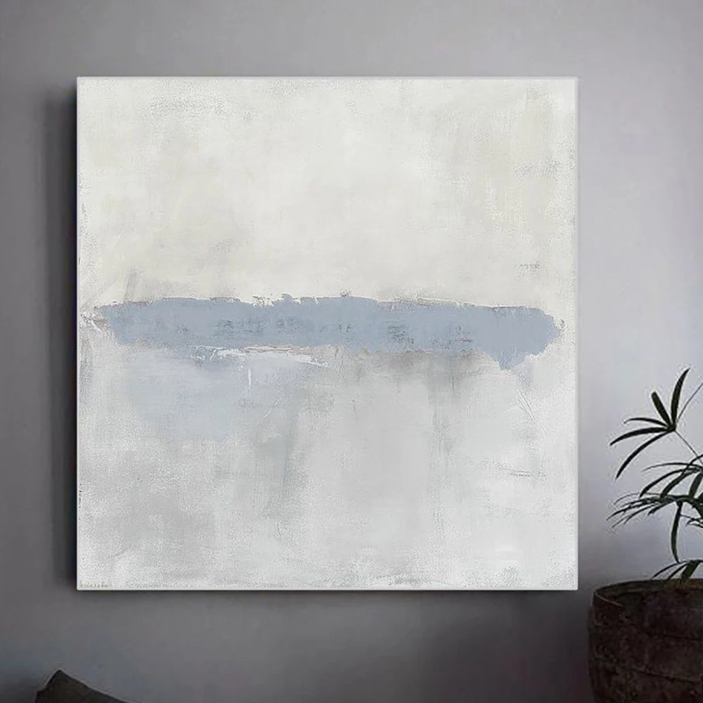 Abstract painting with a blue accent on a gray wall