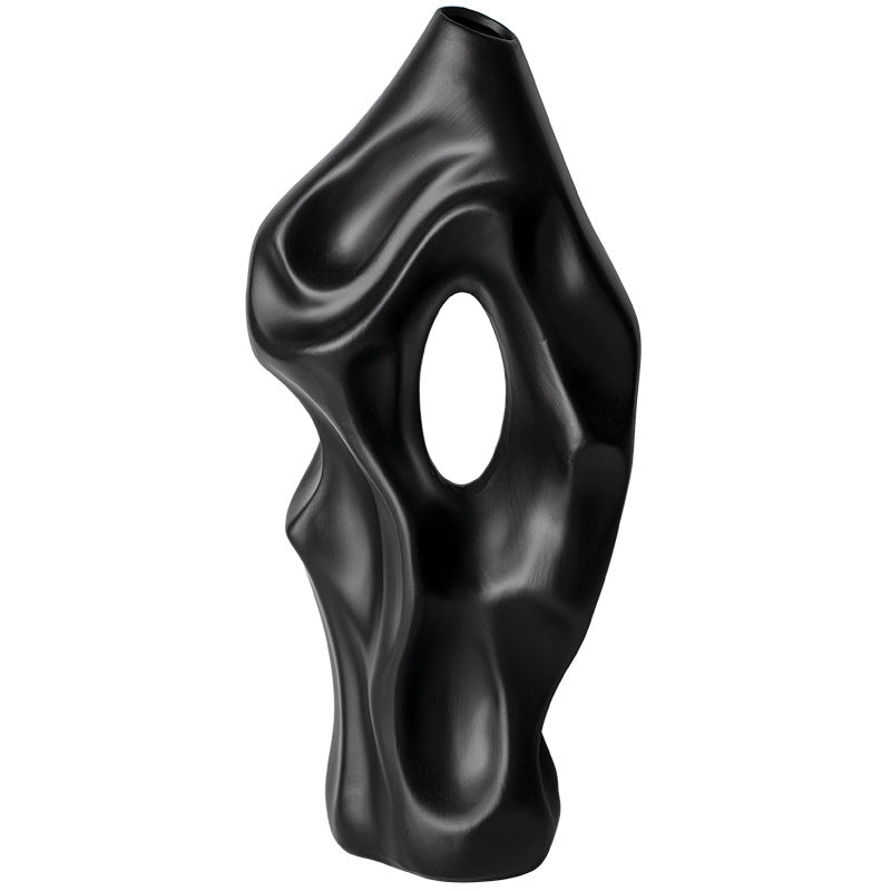 Black abstract vase on a white background
