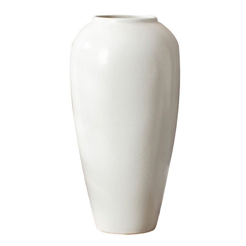 White ceramic vase on a white background