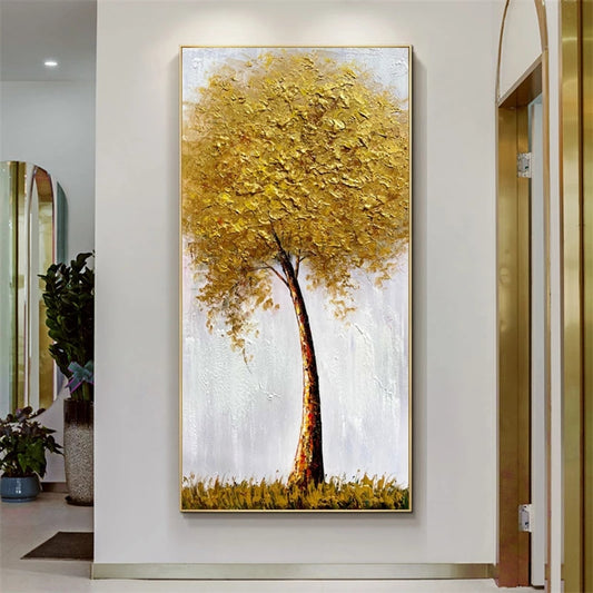 Abstract painting of a tree with yellow leaves on a white wall.