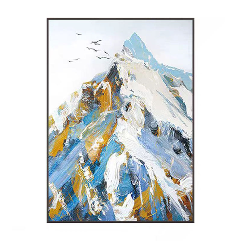 Framed abstract painting of a mountain landscape with blue, white, and gold colors.