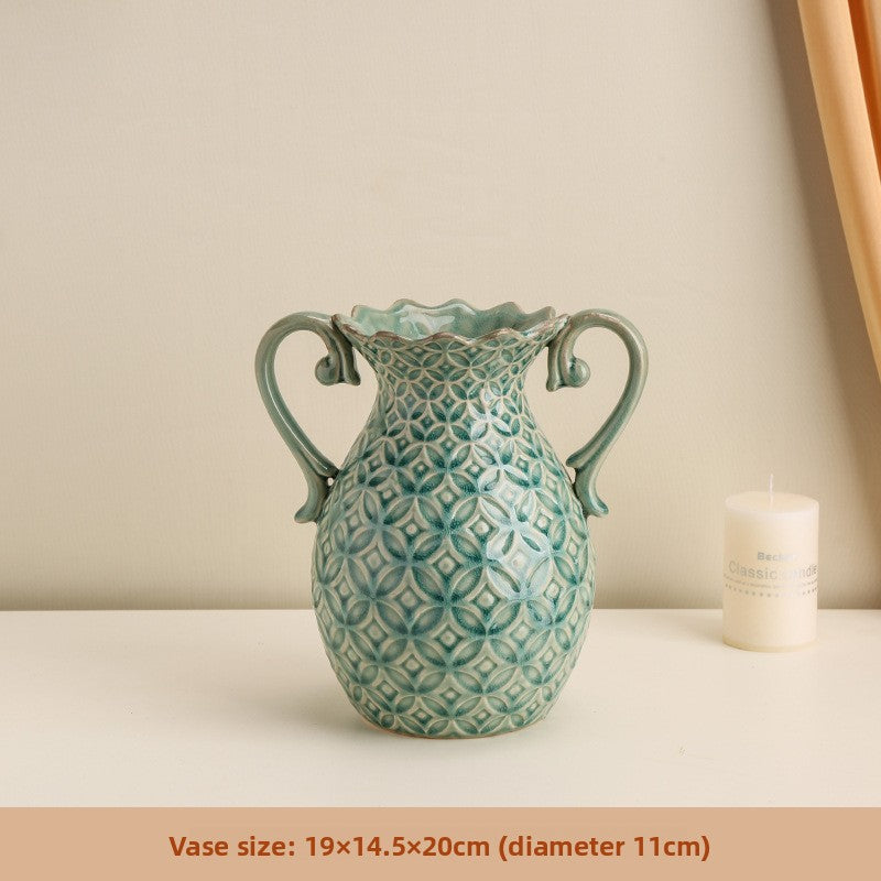 Decorative ceramic vase with geometric pattern on a neutral background