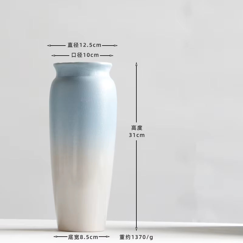 Gradient-colored cylindrical container with measurements on a white background