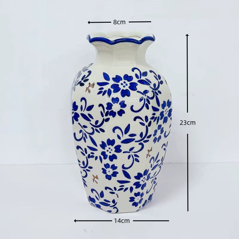 White vase with blue floral patterns and measurements on a white background