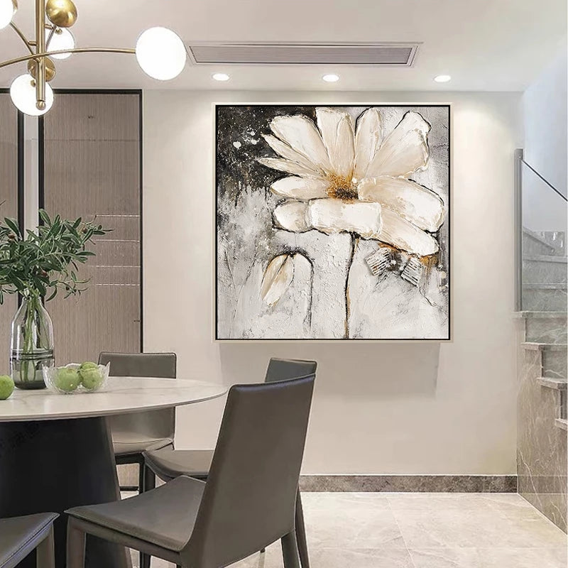Dining room with a large abstract flower painting on the wall.