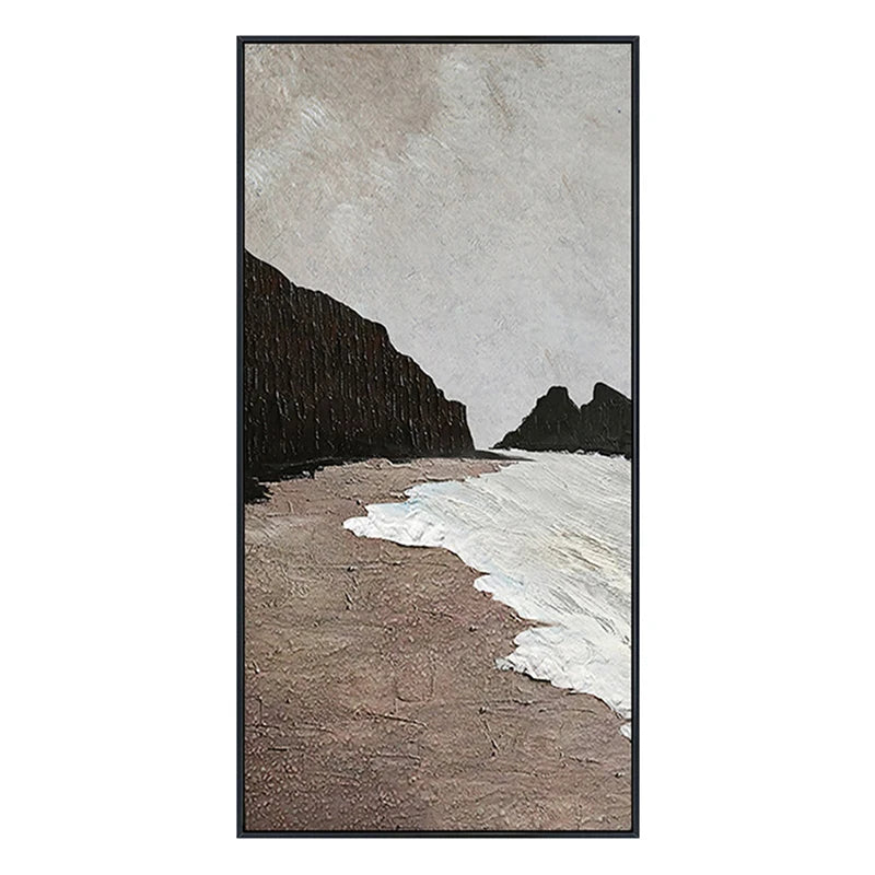 Framed artwork of a beach scene with cliffs and waves.