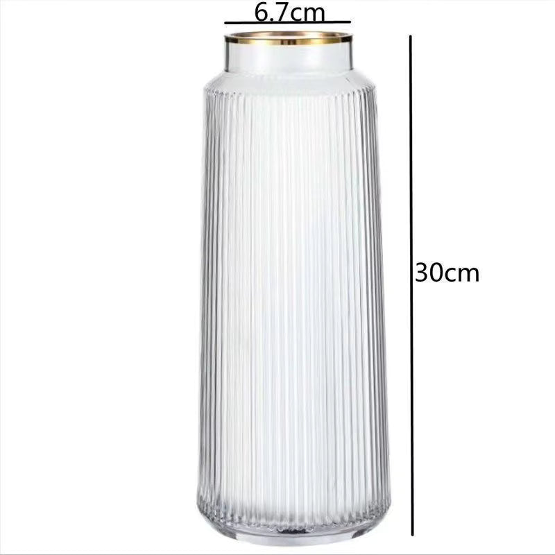 Clear ribbed vase with gold rim and dimensions on a white background