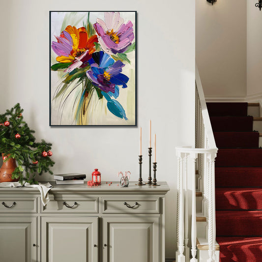 Decorative floral painting on a wall above a cabinet with Christmas decorations.