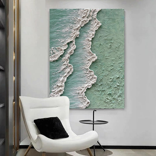 Modern interior with a white chair and small table, featuring a large abstract painting of ocean waves.