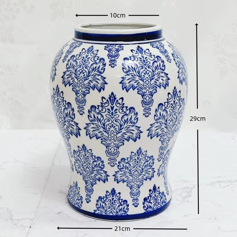 Blue and white patterned vase with measurements on a white background