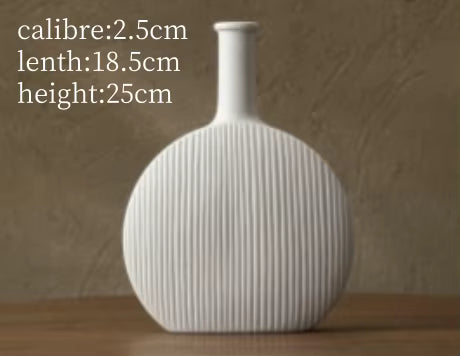 White ribbed vase on a wooden surface with measurements displayed.