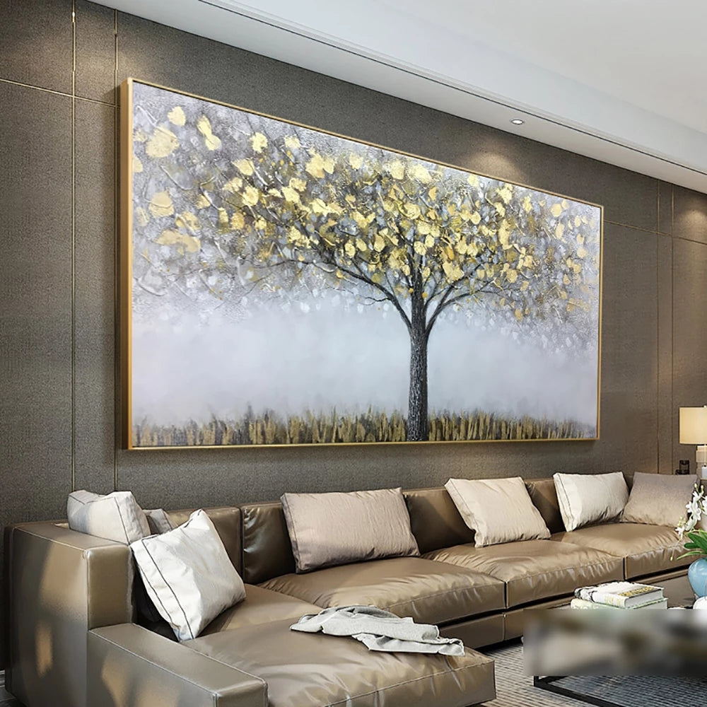 Decorative wall art of a tree with yellow leaves in a modern living room.