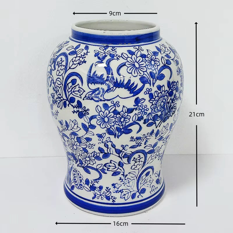 Ceramic vase with blue floral and dragon design, shown with measurements on a white background