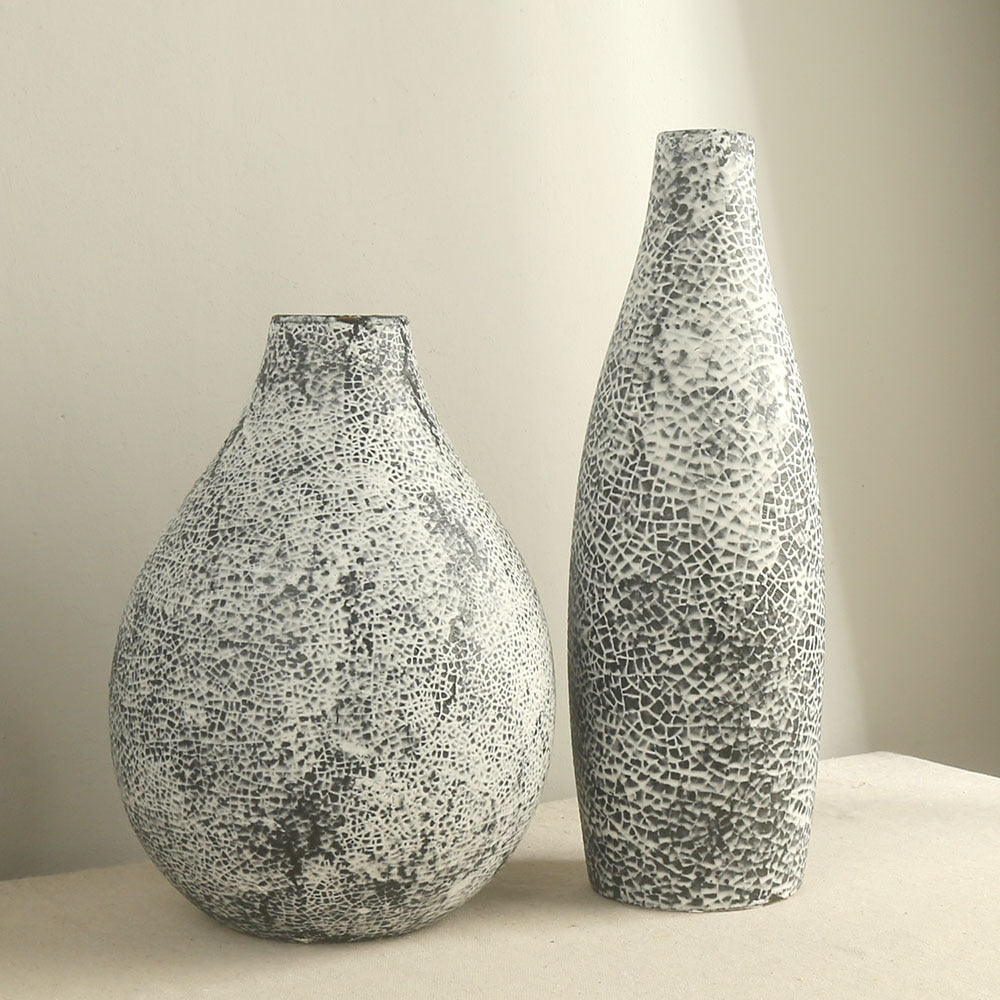 Two textured vases on a neutral background