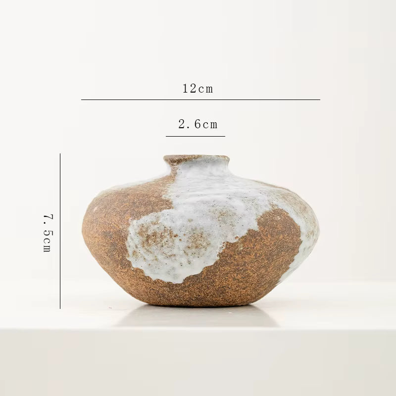 Ceramic vase with measurements on a white background