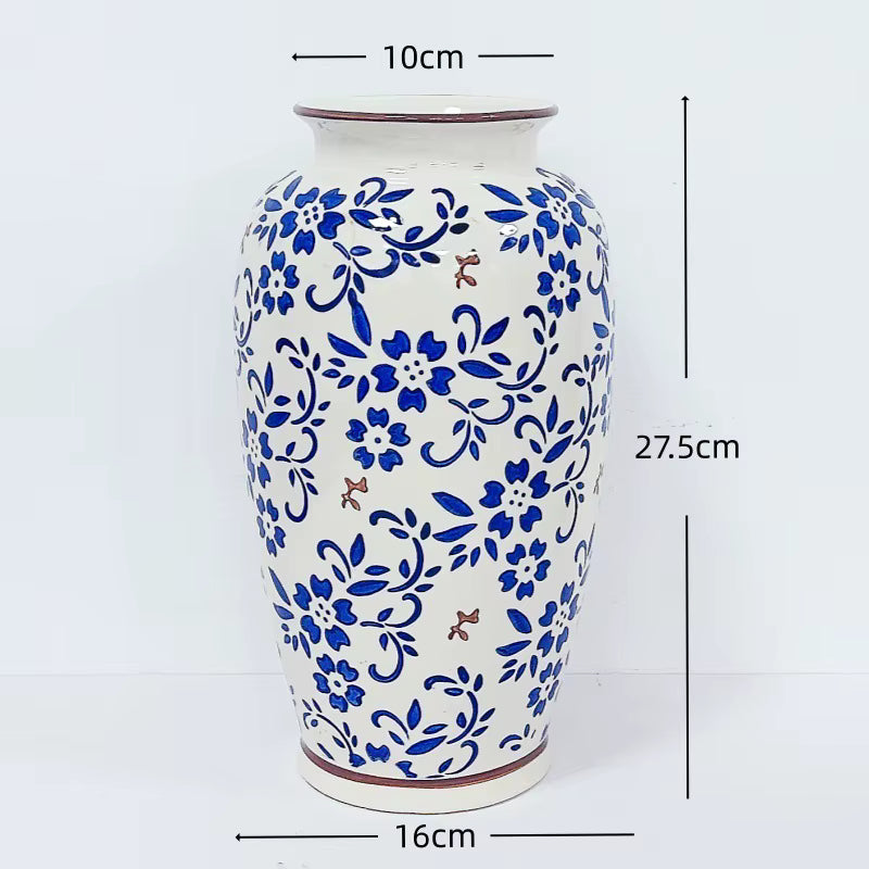 Ceramic vase with blue floral patterns and measurements on a white background
