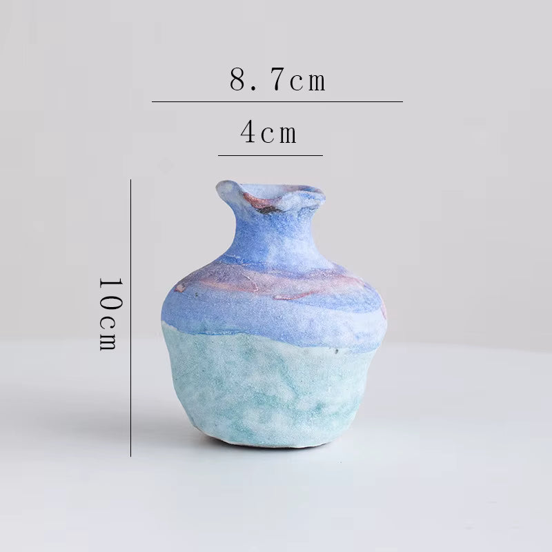 Ceramic vase with measurements on a light gray background