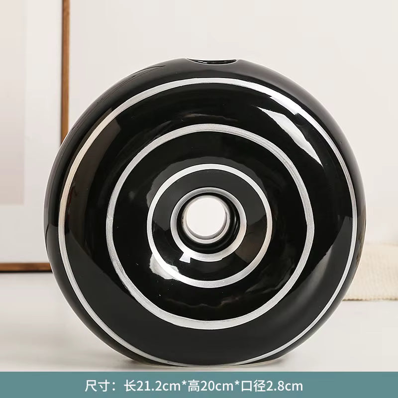 Black and white circular object on a light background