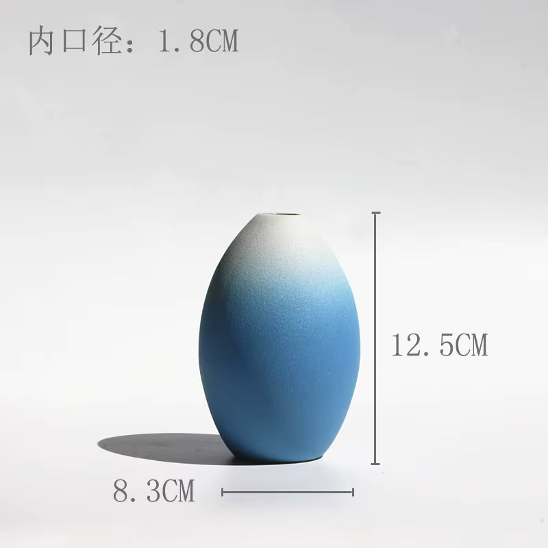Blue gradient vase with measurements on a white background