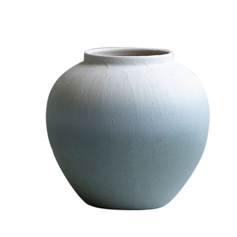 Light blue ceramic vase on a white background