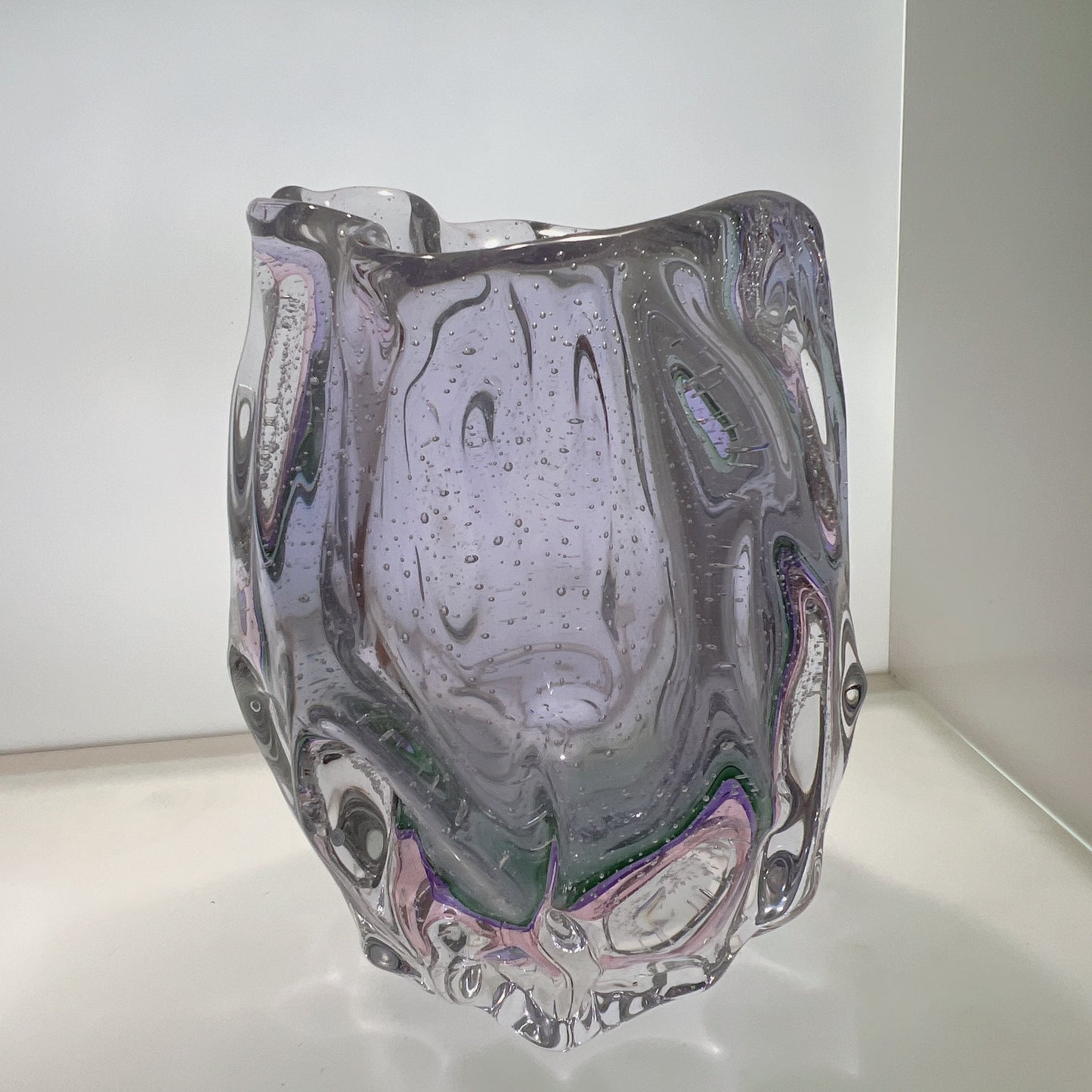 Glass vase with marbled design on a white background
