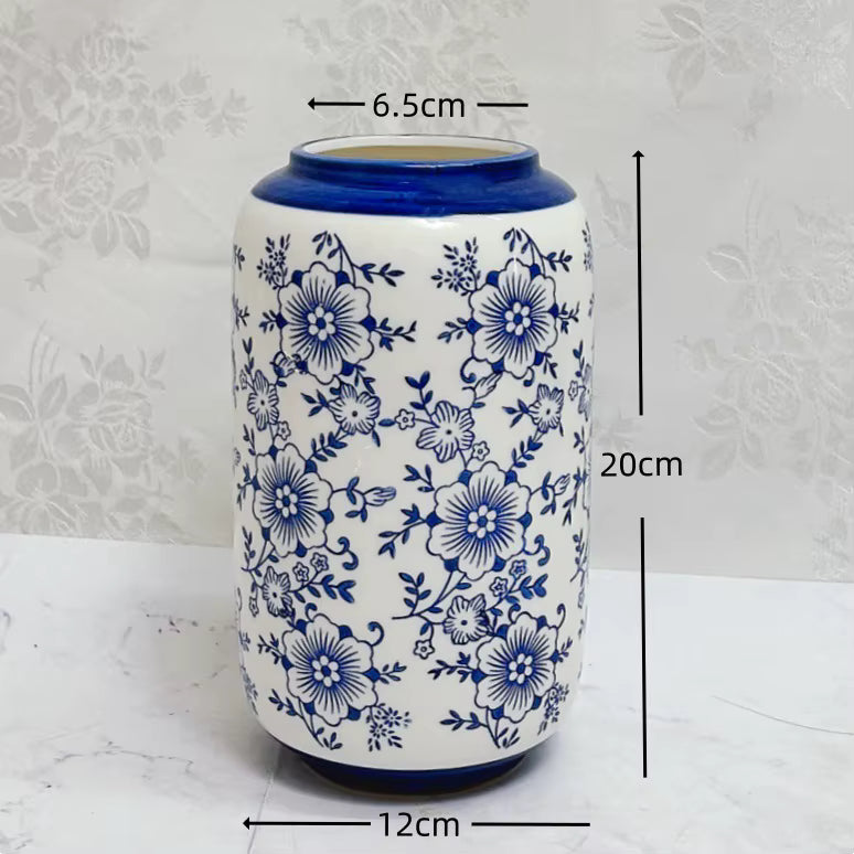Ceramic vase with blue floral patterns and measurements on a white background