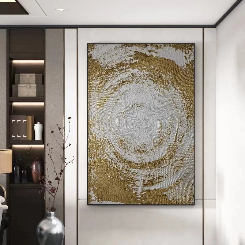 Decorative wall art with gold and white circular design in a modern interior setting.